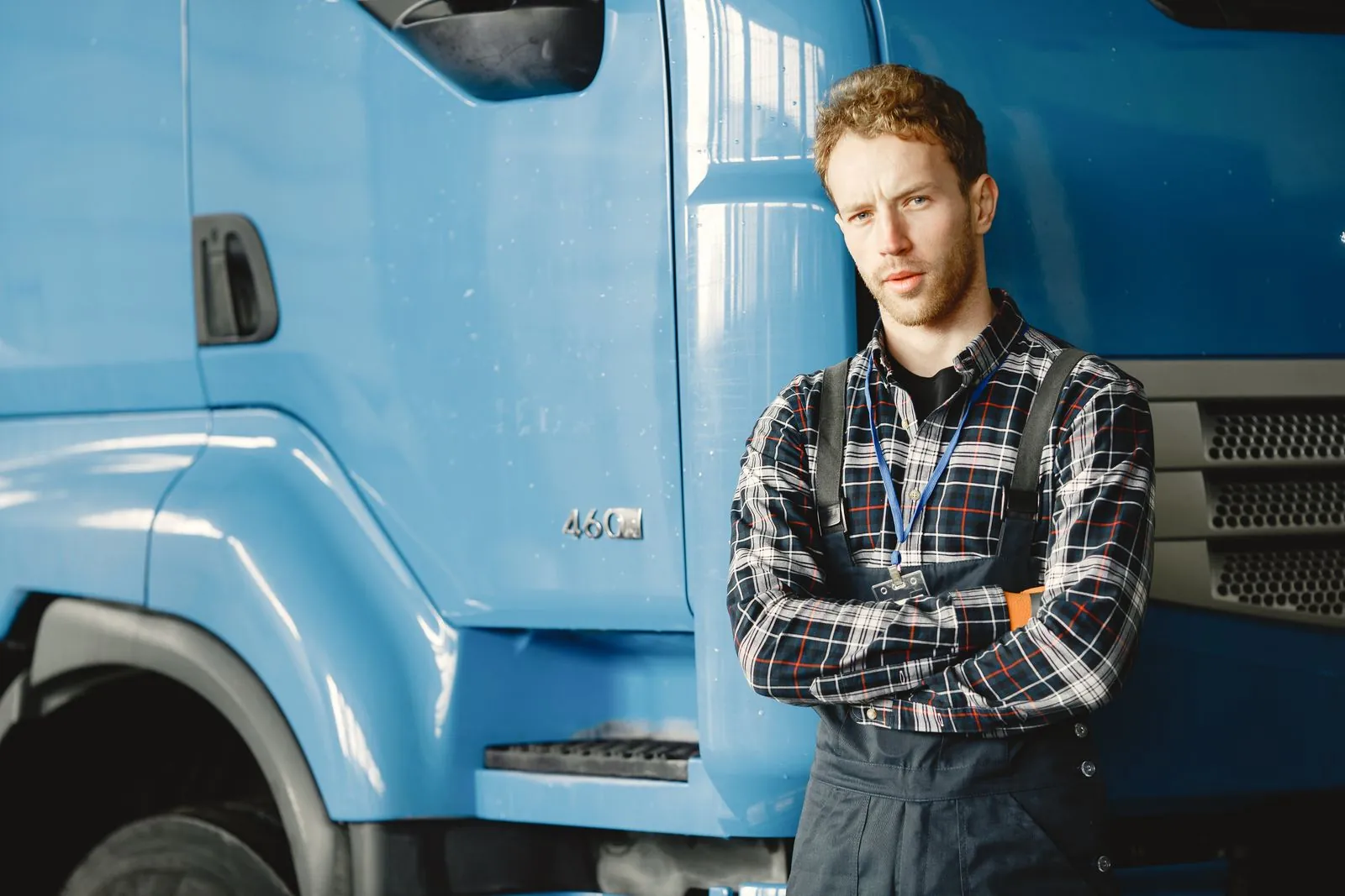 Tom Calloway standing in front of the IronPost company truck