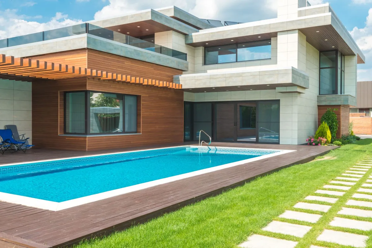 Luxury modern home with a long inground backyard pool