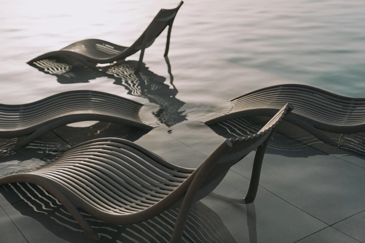 Tanning ledge loungers submerged in shallow pool water