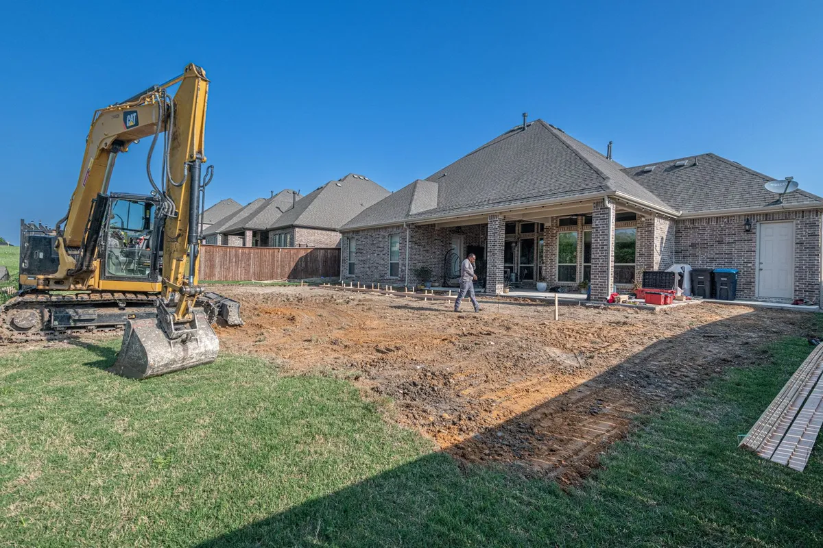 Backyard pool excavation under construction